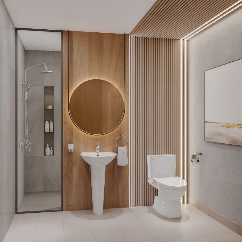 Phối cảnh không gian nội thất phòng tắm đẳng cấp với chiếc bàn cầu cao cấp được sắp đặt như một điểm nhấn nghệ thuật tinh tế giữa hệ thống ánh sáng và gạch ốp hiện đại.